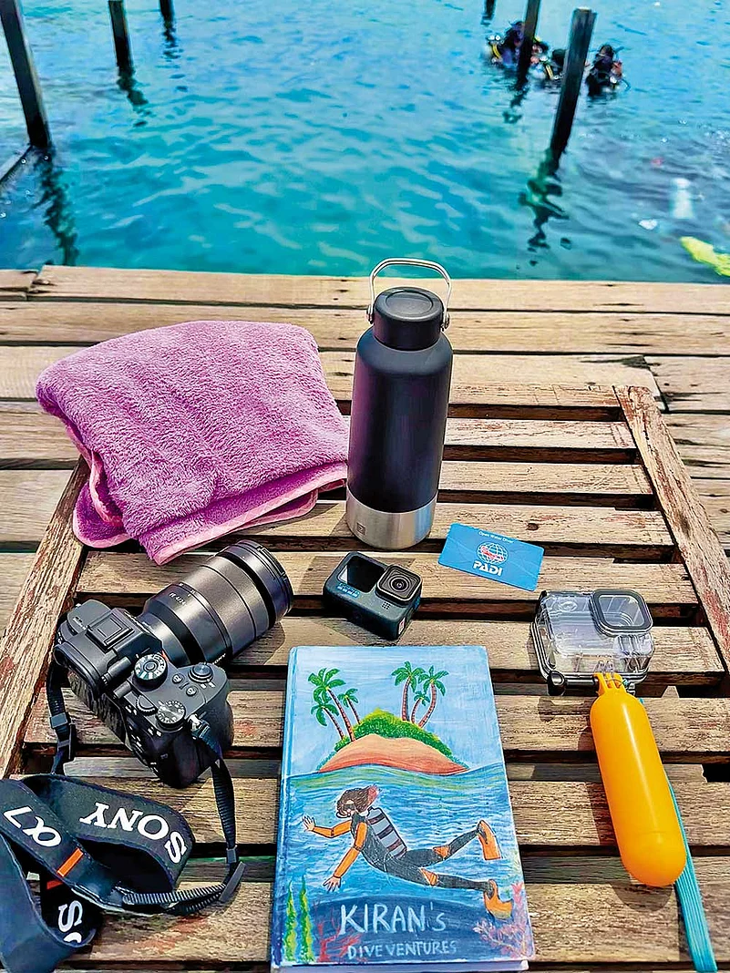 Surface interval routine: inspect equipment, take notes, prep cameras, hydrate