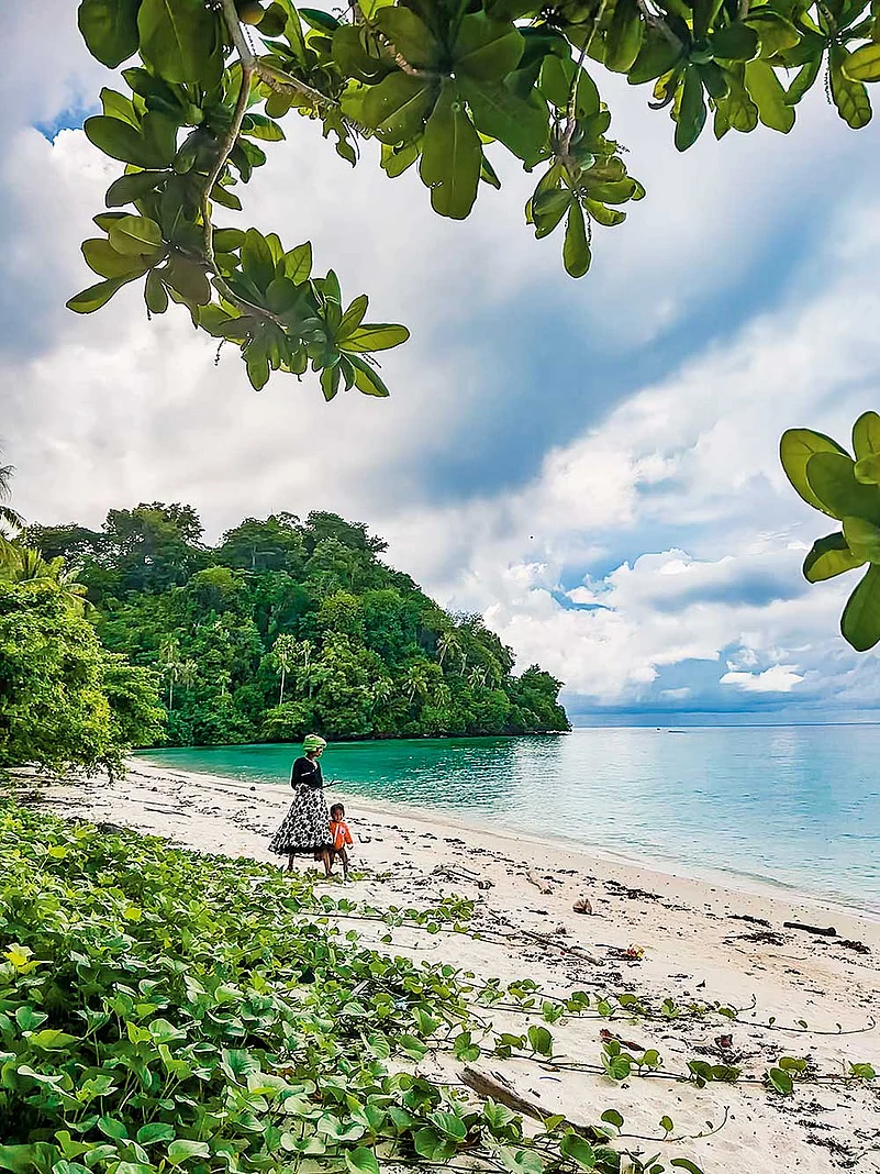 The Bajau moving along the beach