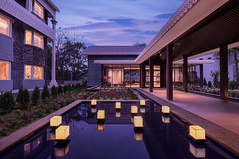 Naukuchia House has glass-lined corridors, lake-facing rooms, and passive heating design make it climate-conscious as it is contemplative
