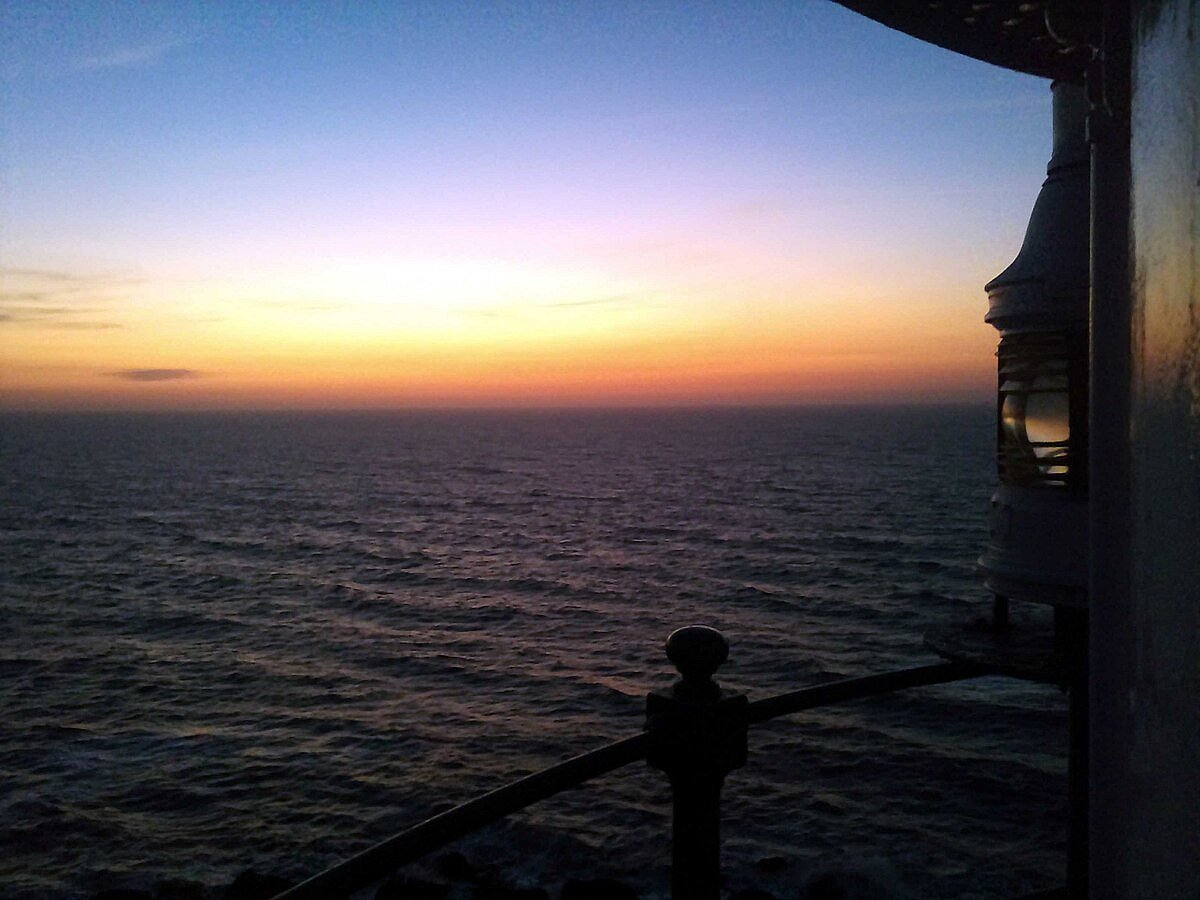 Jaigad Lighthouse stands on a rocky cliff offering sweeping views of the Arabian Sea