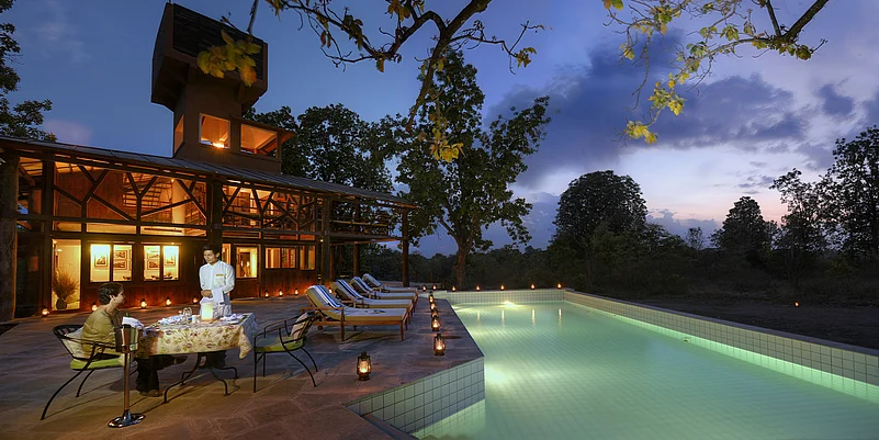 Poolside dinner at Pench Tree Lodge
