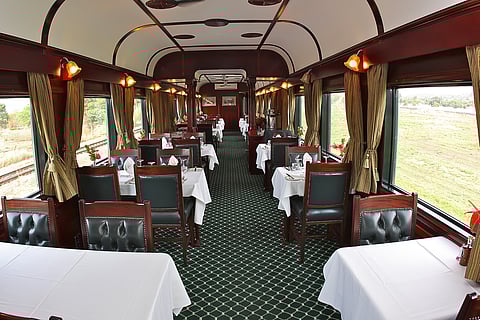 Interior dining car of Rovos Rail’s vintage steam train, South Africa
