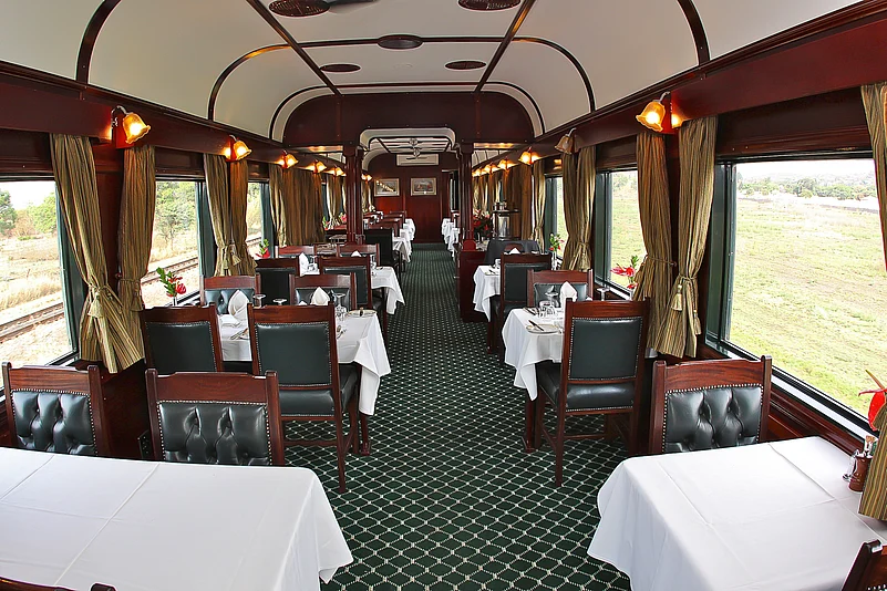 Interior dining car of Rovos Rail’s vintage steam train, South Africa
