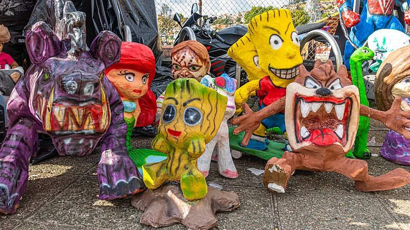 A local market in Ecuador sells Monigotes (papier-mache or rag dolls that are burnt at midnight to celebrate the New Year)