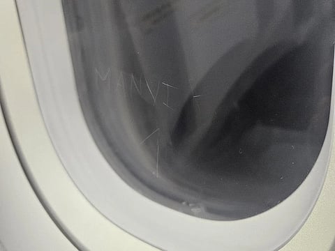 A Redditor posted posted an image of a passenger’s name etched on aircraft window