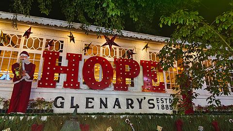 Tourists flock in front of Glenary's in Darjeeling for photographs