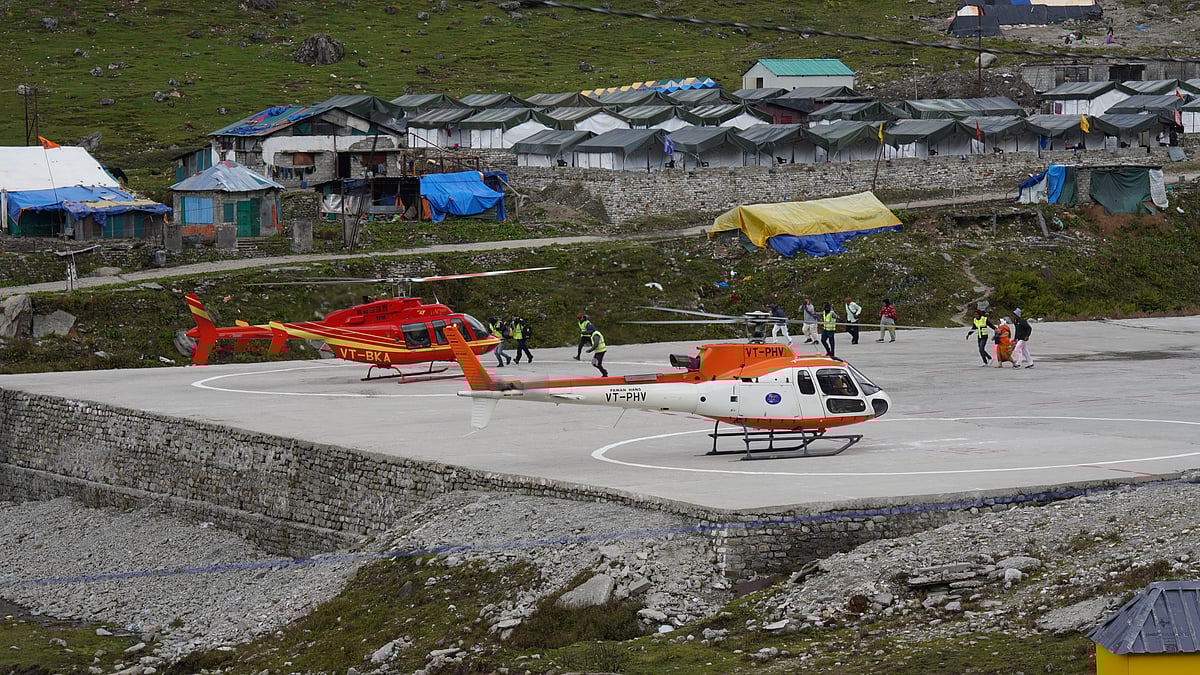 Pilgrims arrive by helicopter near Kedarnath Temple