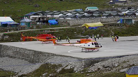 Pilgrims arrive by helicopter near Kedarnath Temple