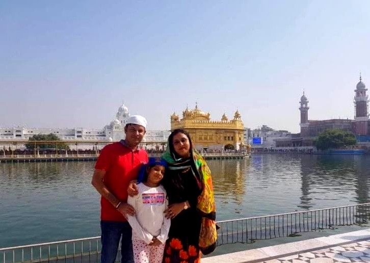 An old image of the author with her parents at Golden Temple