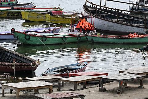 Boats moving along the River Ganga in Varanasi