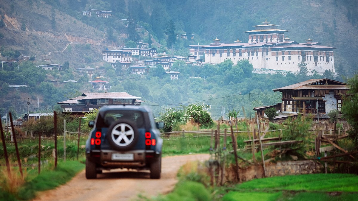 Bhutan’s forested ridges and ancient monasteries through the windshield