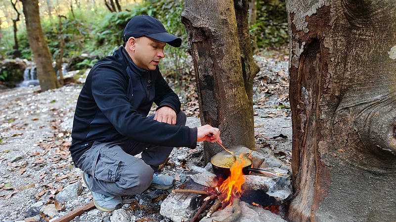 Cooking Maggi noodles on a wood fire