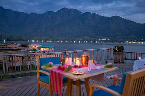 Floating on Dal Lake, this serene houseboat offers romance wrapped in stillness, views and Kashmiri charm