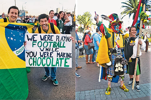 Fans in colourful attire and merchandise with handmade signs are a common sight around most matches