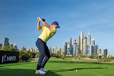 A golfer takes a swing