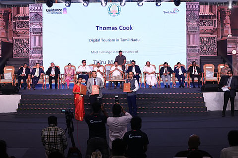 Abraham Alapatt of  Thomas Cook India (right) signing the MoU