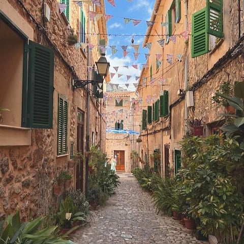 Explore the picturesque, pedestrian-only cobblestone streets with flower pots