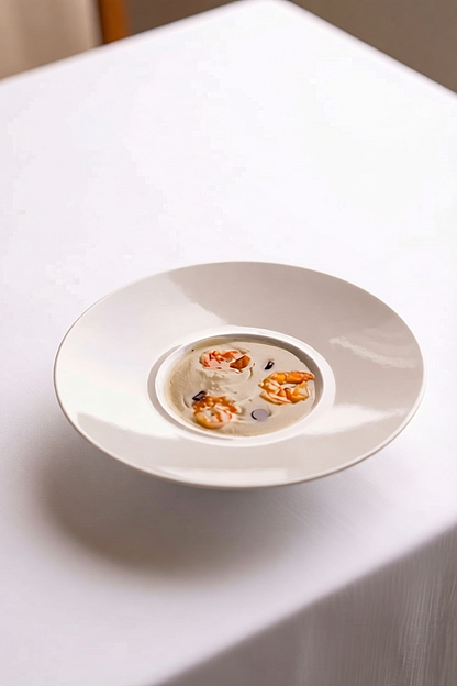 Jerusalem artichoke soup topped with spiced confit prawn and dark chocolate