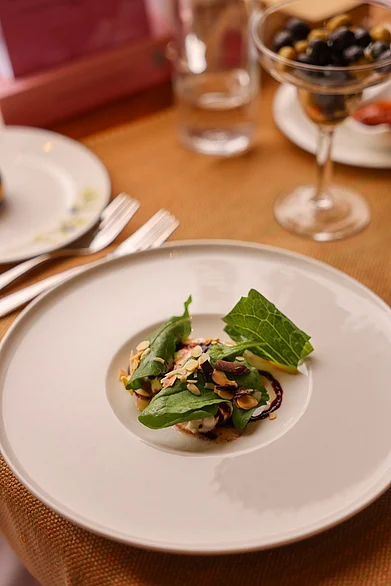 VJSuraj : Marinated burrata with mesclun greens sour cherry glaze and dark chocolate curls