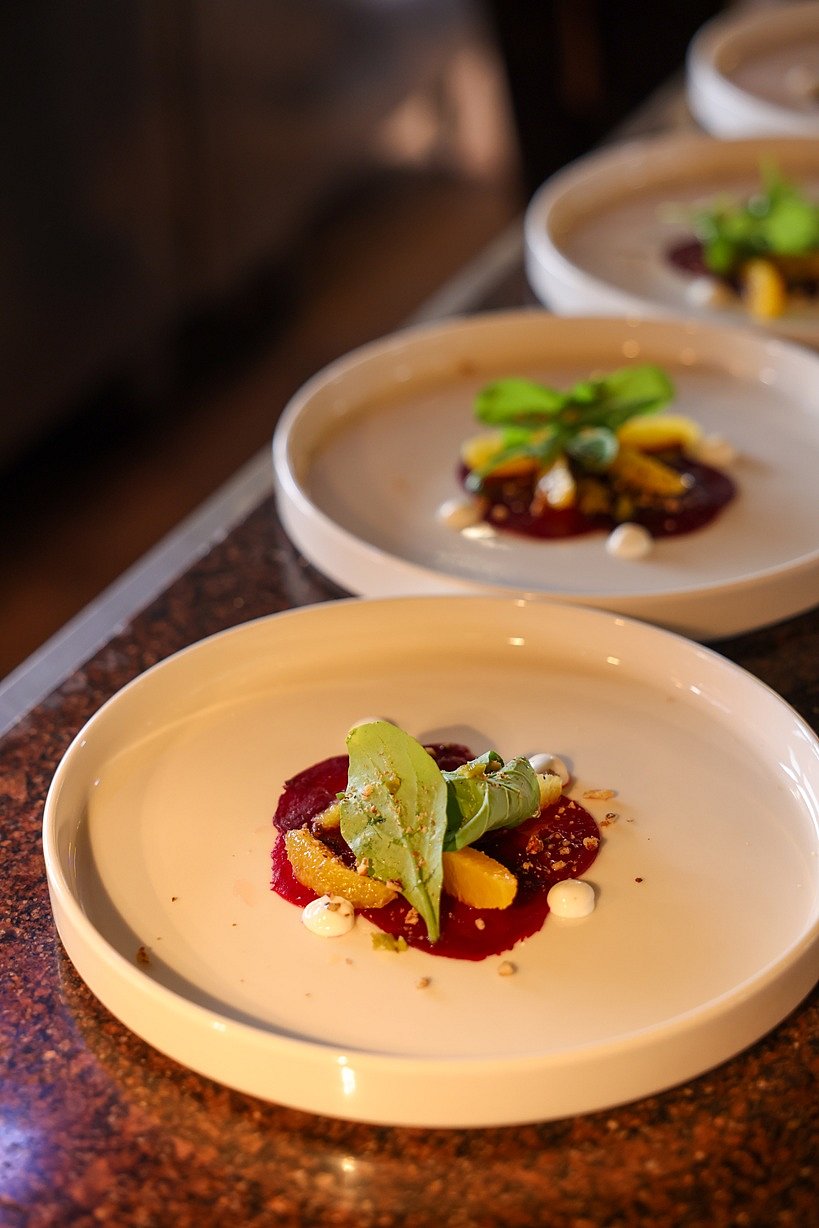 Beet carpaccio with goat cheese and white chocolate drizzle