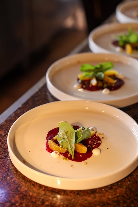 Beet carpaccio with goat cheese and white chocolate drizzle