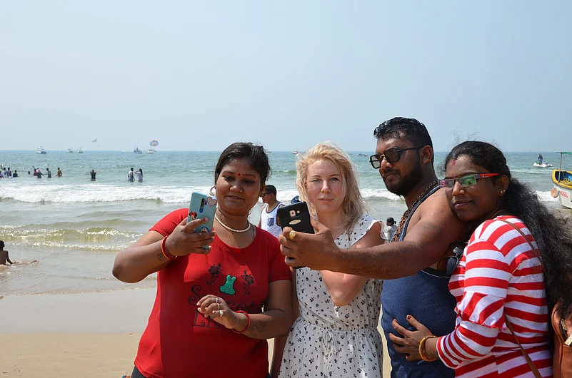 Tourists posing for a photo on a North Goa beach (Representative Image)