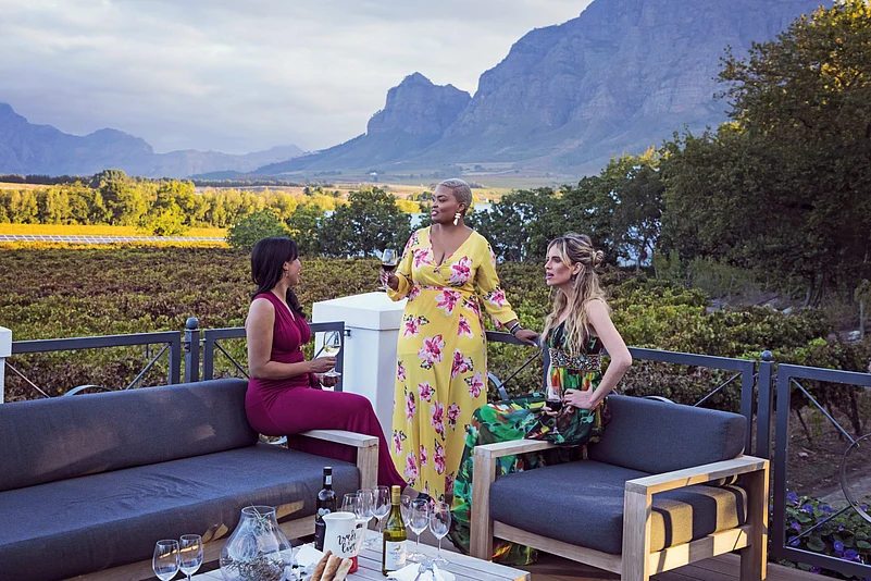 Three women wine tasting on a wine farm