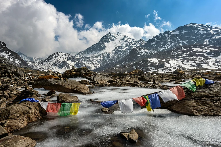 Prayer flags flutter across the Himalayas, a familiar sight on Nepal’s iconic trekking routes - Unsplash