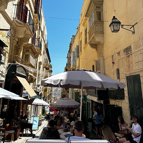 Valletta lanes unfolding toward the harbour