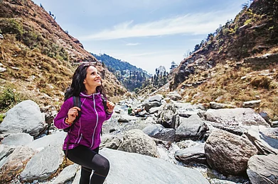 Shutterstock : A woman trekking in the Himalayas