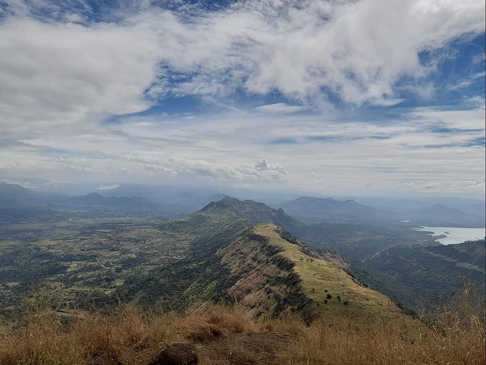 Monsoon clouds sweep across the flower-strewn expanse of Garbett Plateau near Matheran