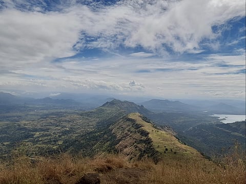 Monsoon clouds sweep across the flower-strewn expanse of Garbett Plateau near Matheran