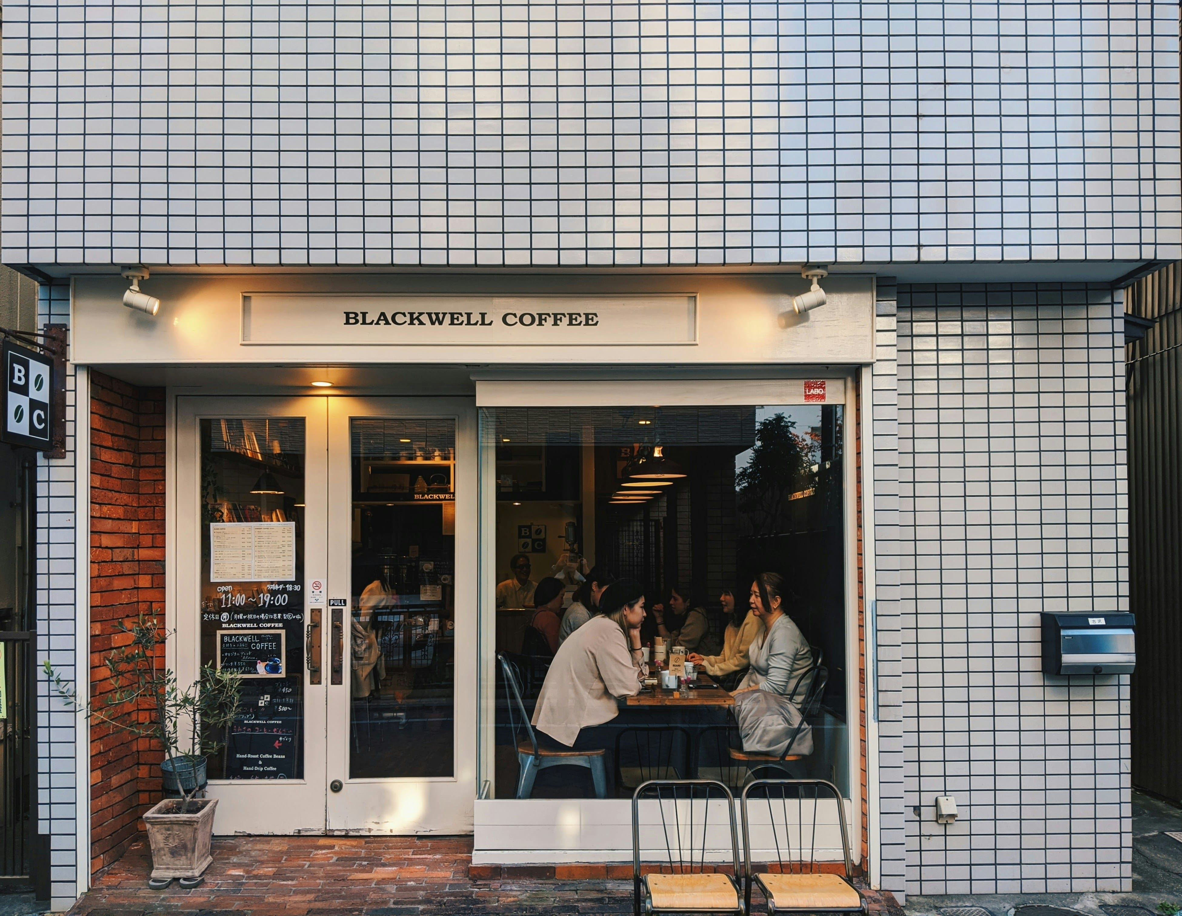 People sit at a cafe in Tokyo