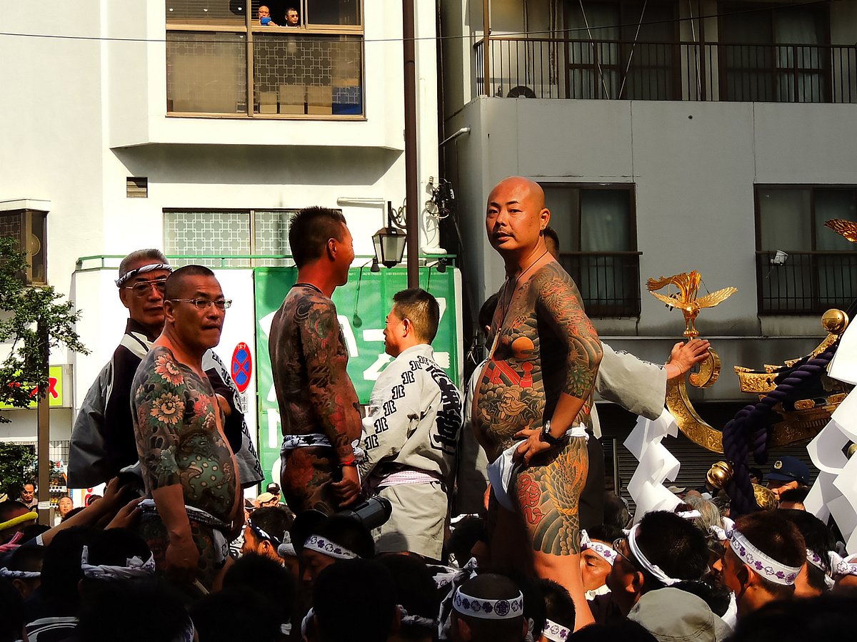 Participants display traditional tattoos during Sanja Matsuri