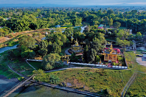 An aerial view of the river island in Chongkham, with the World Peace Pagoda visible at the centre