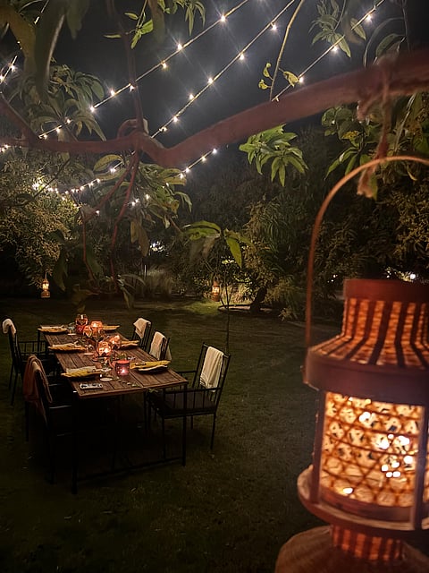 Set up for a silent dinner in the mango orchard