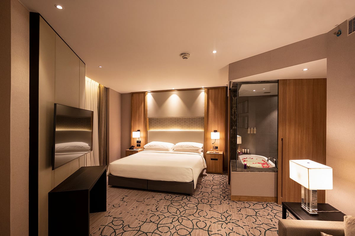 A spacious room at Lyfe Hotels, overlooking the lively Janpath Road