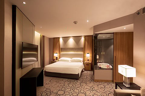 A spacious room at Lyfe Hotels, overlooking the lively Janpath Road