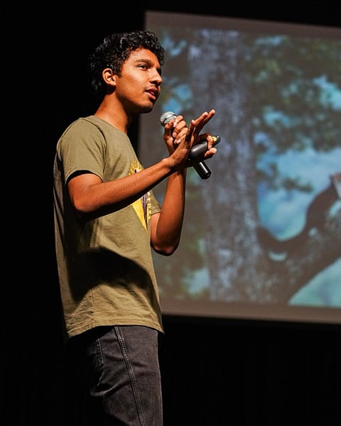 Ishan Shanavas speaking on wildlife and nature at an environmental education programme.