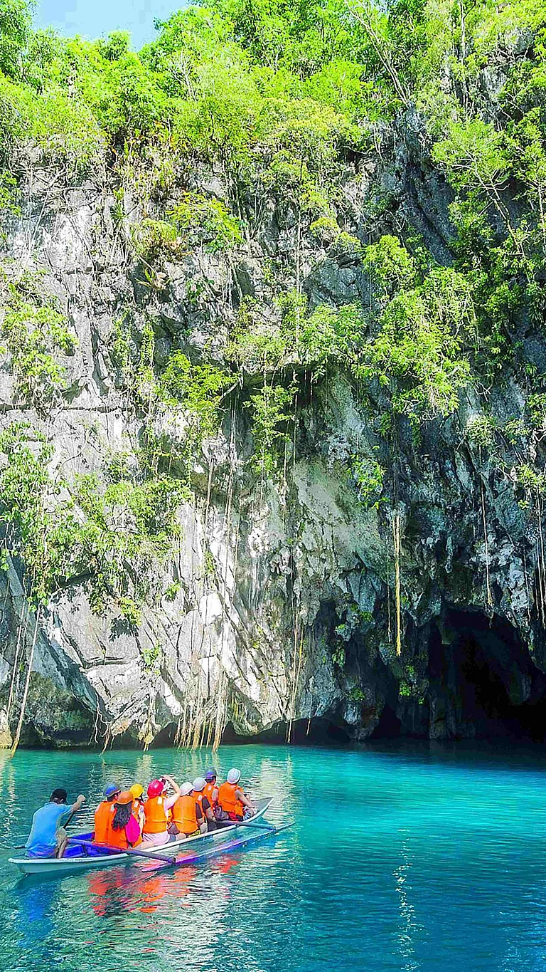 A boat going into a cave - Unsplash