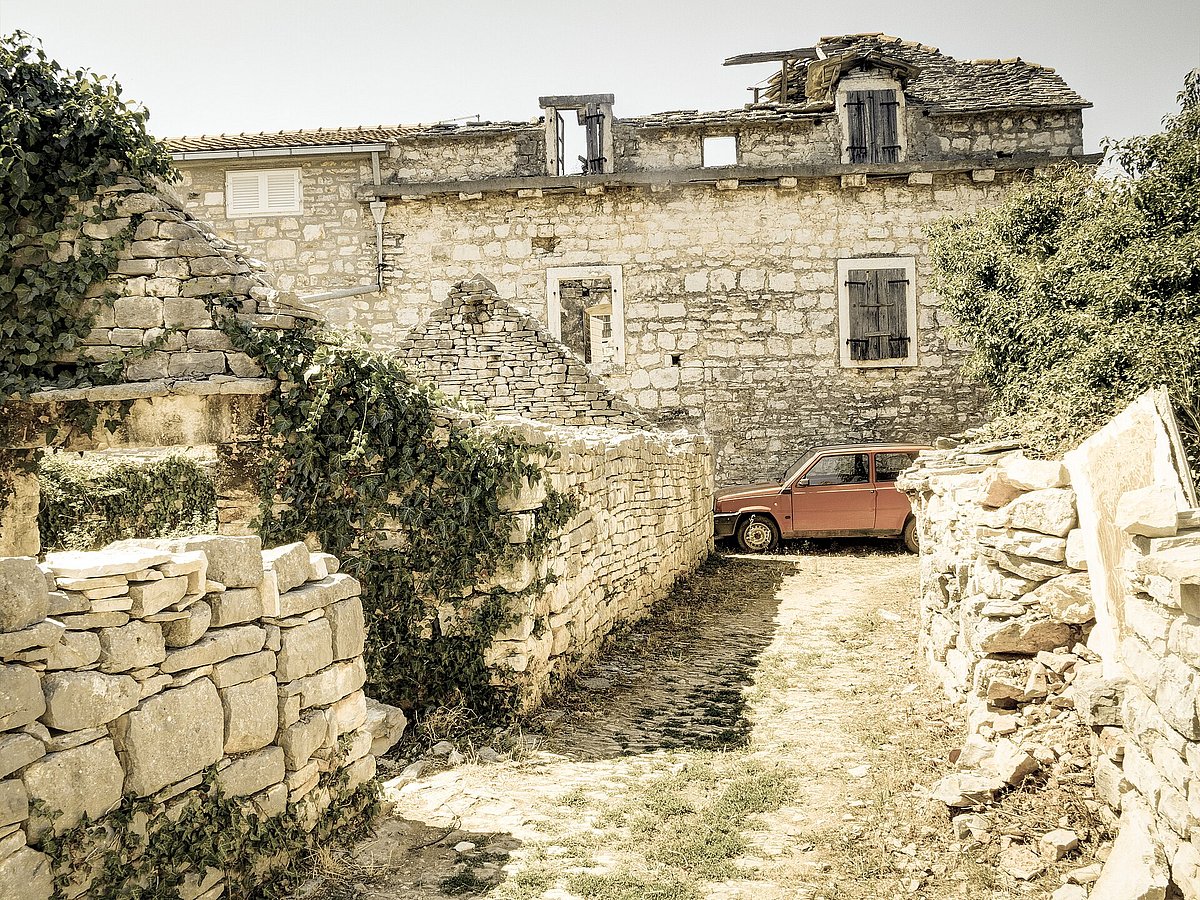 Old limestone houses in Grohote on the island Šolta, Croatia 