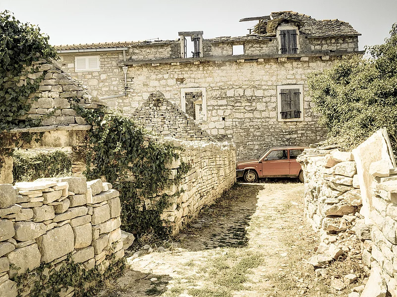 Old limestone houses in Grohote on the island Šolta, Croatia