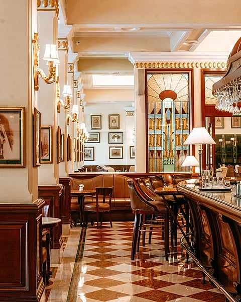 Paintings, lithographs, and historical maps appear throughout the property.