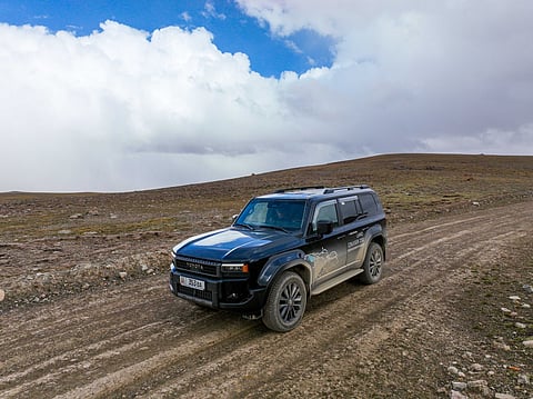 Toyota Land Cruiser on a rugged dirt road