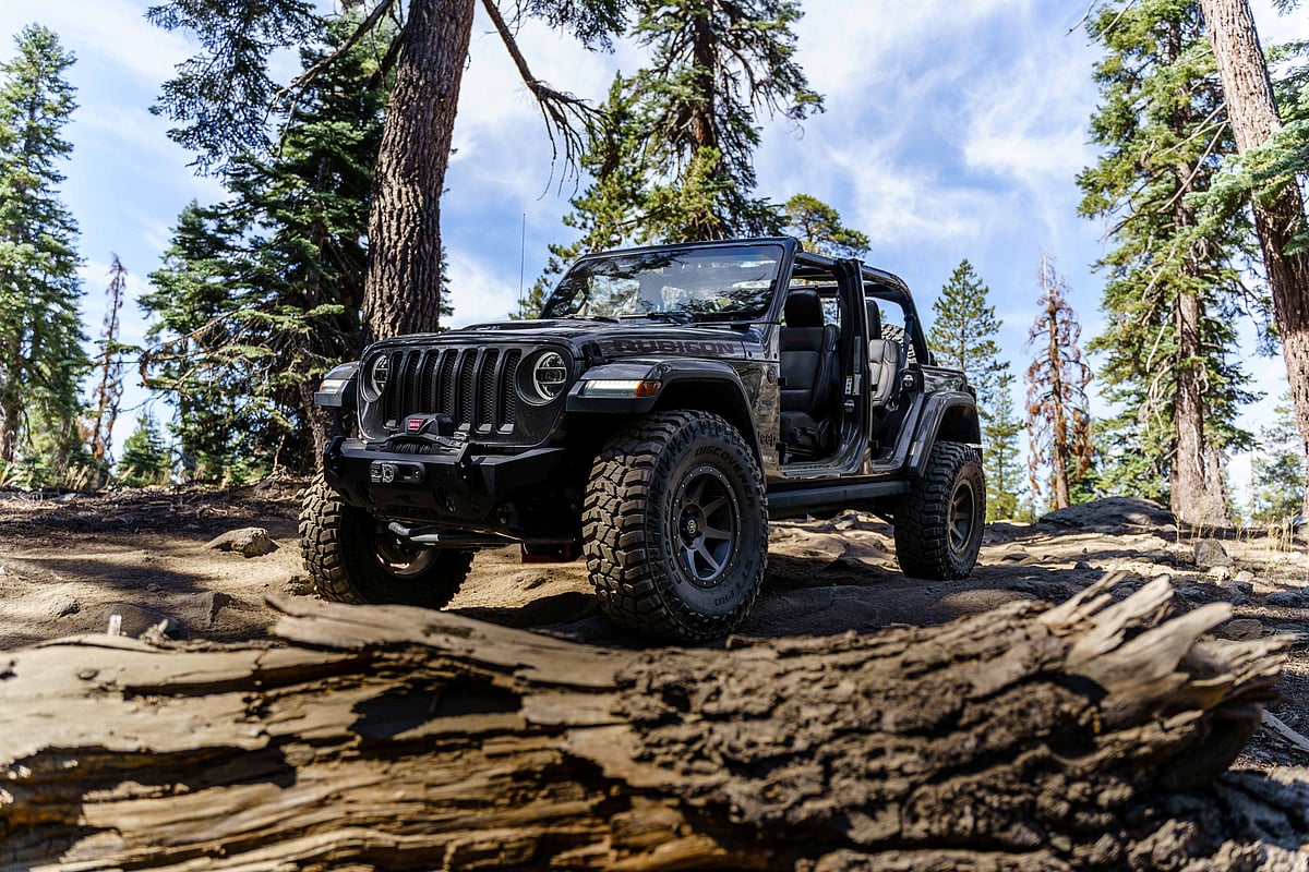 Jeep Wrangler Rubicon tackling rocky off-road terrain