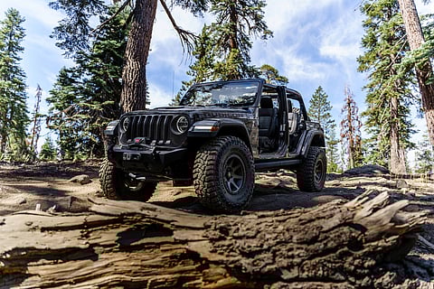 Jeep Wrangler Rubicon tackling rocky off-road terrain