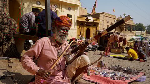 An artist from the Bhopa Community plays a Rawanhatta