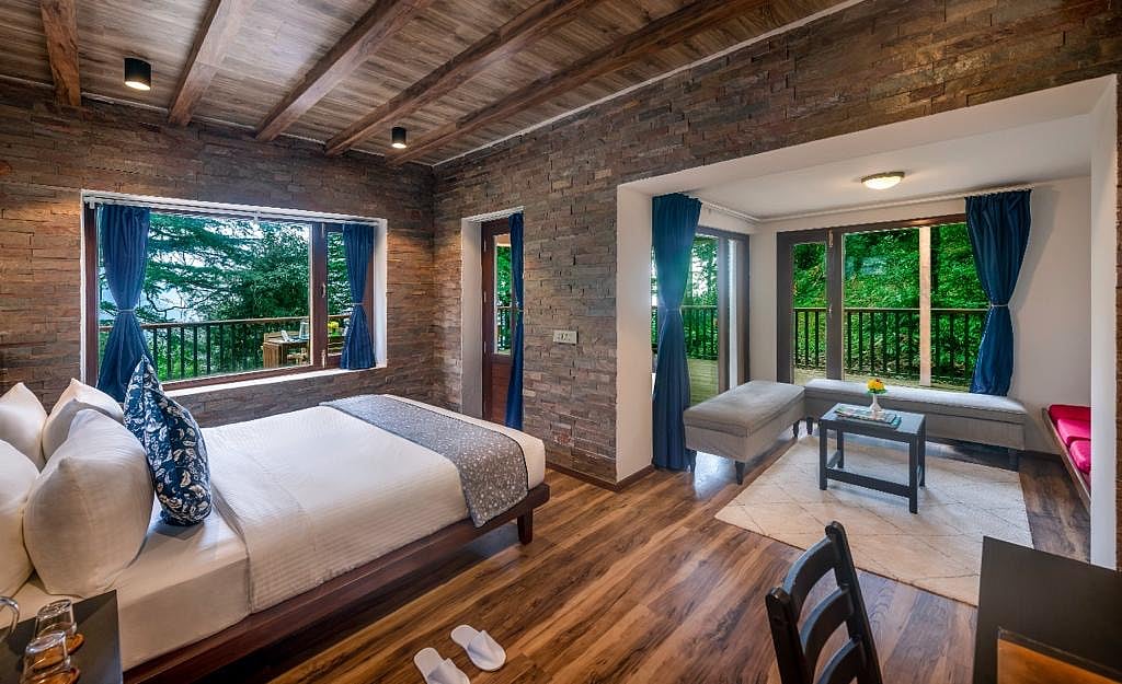 Eagles Nest Dharamshala houses 20 rooms and suites, each room opening up to the Dhauladhar range