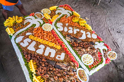 Traditional Filipino feast set up on Guyam Island