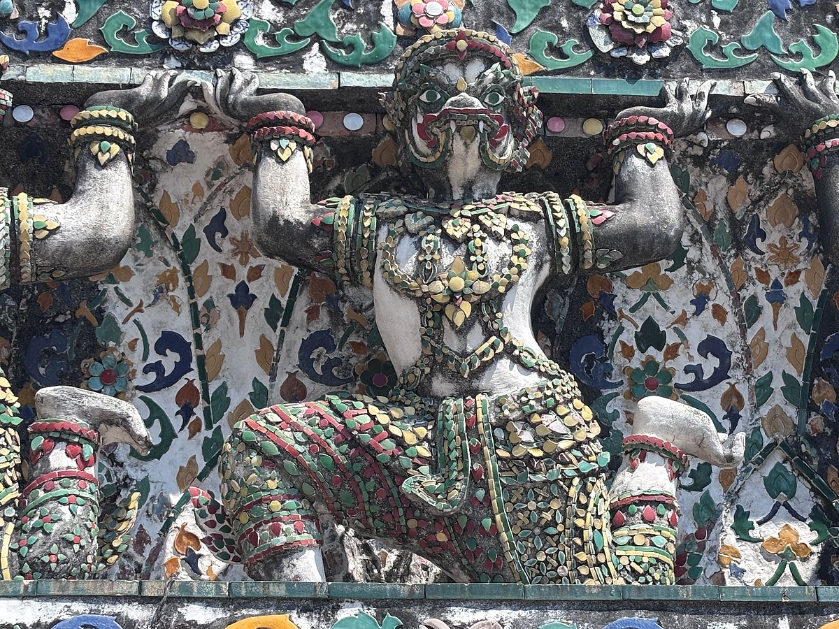 Guardian warrior on the central prang of Wat Arun in Bangkok, Thailand